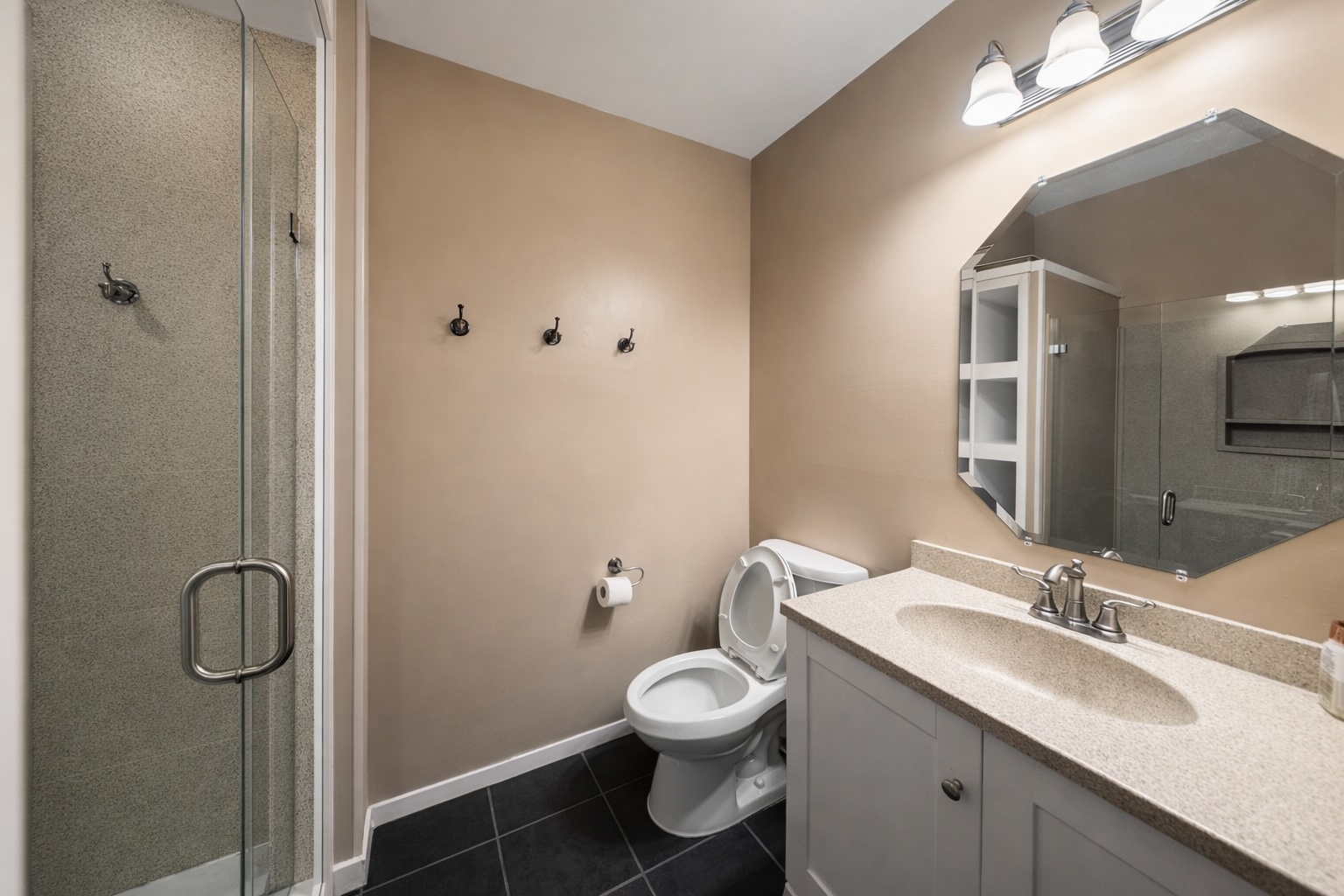 808 West 29th Street, Unit 206 Austin, TX 78705 - Photo 15 of 17 a bathroom with a toilet sink a mirror and vanity
