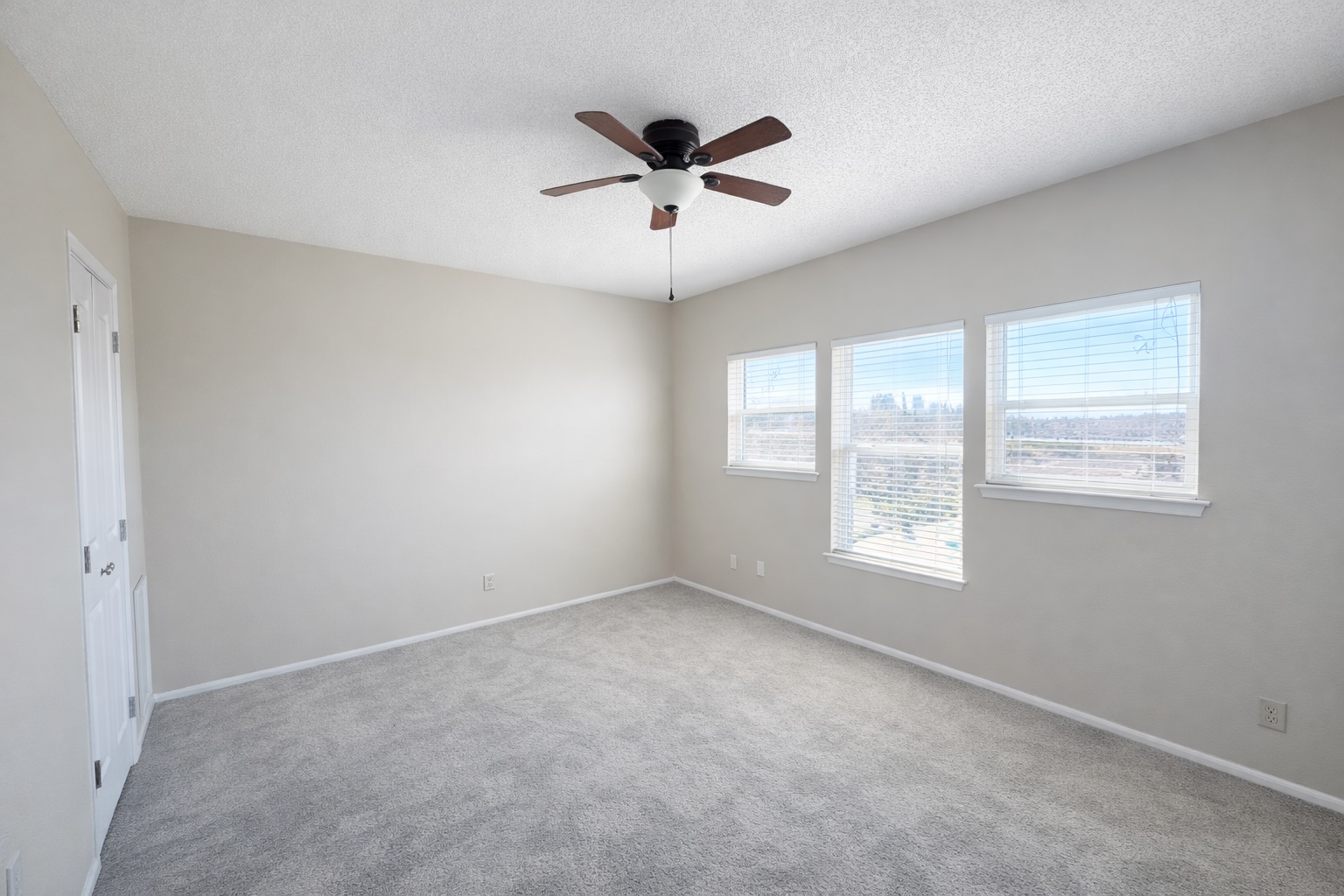 808 West 29th Street, Unit 206 Austin, TX 78705 - Photo 4 of 17 wooden floor in an empty room with a window