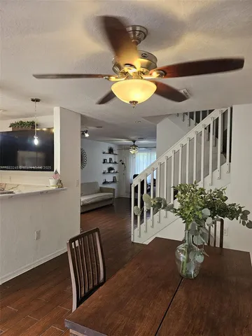 a view of a livingroom with furniture and a flat screen tv