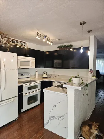 a kitchen with a stove and a microwave
