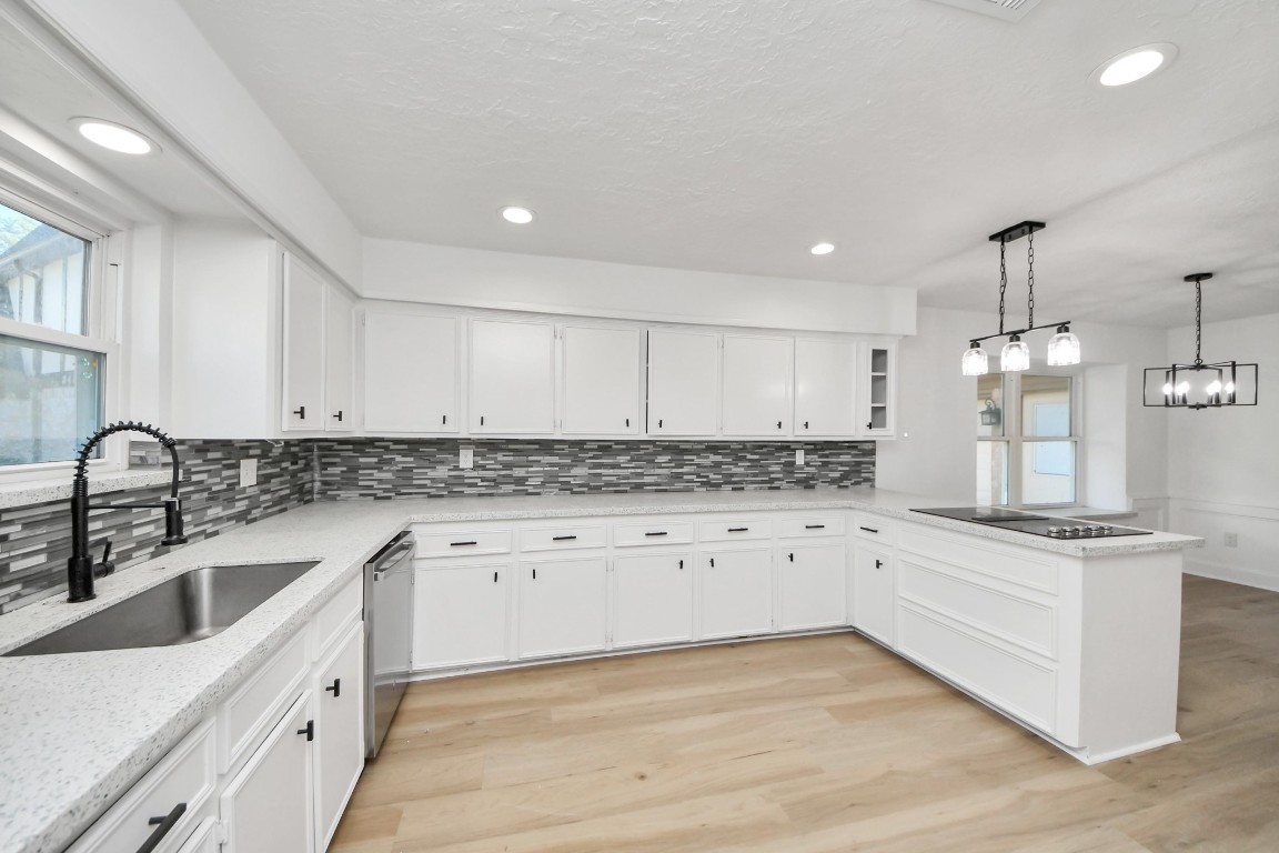 18803 Oakway Drive Spring, TX 77388 - Photo 13 of 47 a kitchen with granite countertop white cabinets and white appliances