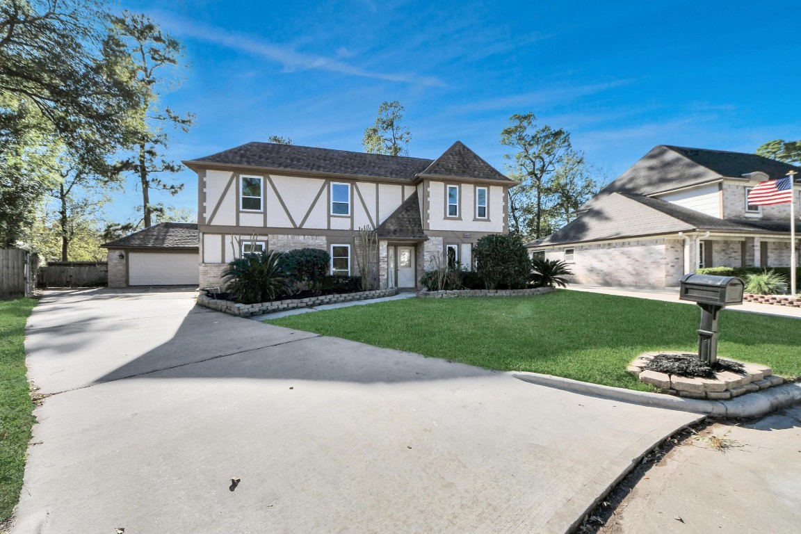 18803 Oakway Drive Spring, TX 77388 - Photo 2 of 47 a front view of a house with a yard