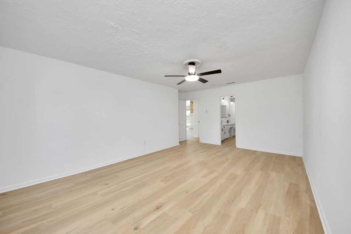 18803 Oakway Drive Spring, TX 77388 - Photo 21 of 47 a view of an empty room with a fan