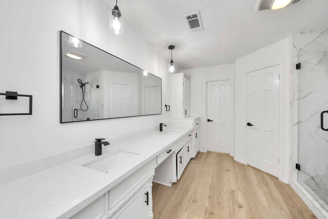 18803 Oakway Drive Spring, TX 77388 - Photo 23 of 47 a bathroom with a tub sink and mirror