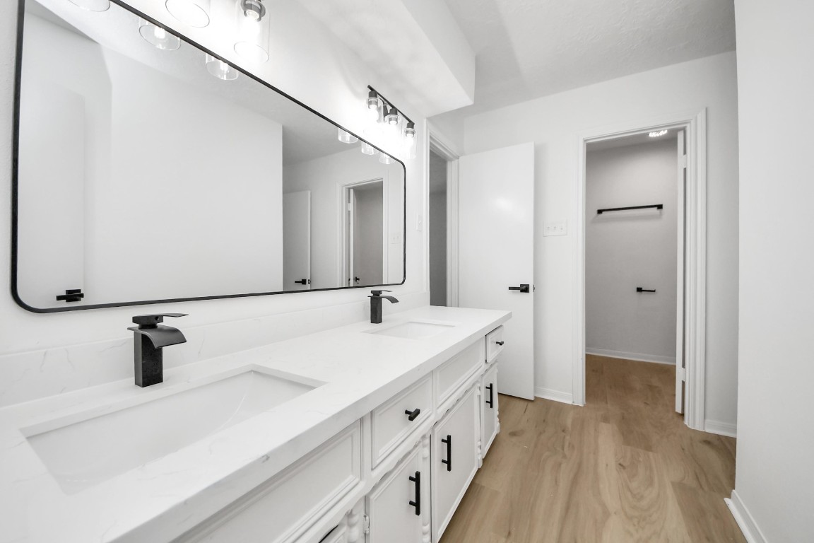 18803 Oakway Drive Spring, TX 77388 - Photo 25 of 47 a bathroom with a sink and a mirror
