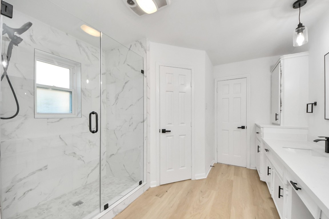 18803 Oakway Drive Spring, TX 77388 - Photo 27 of 47 a spacious bathroom with a double vanity sink a mirror and a shower