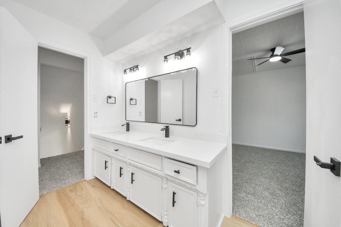 18803 Oakway Drive Spring, TX 77388 - Photo 31 of 47 a bathroom with a double vanity sink and mirror