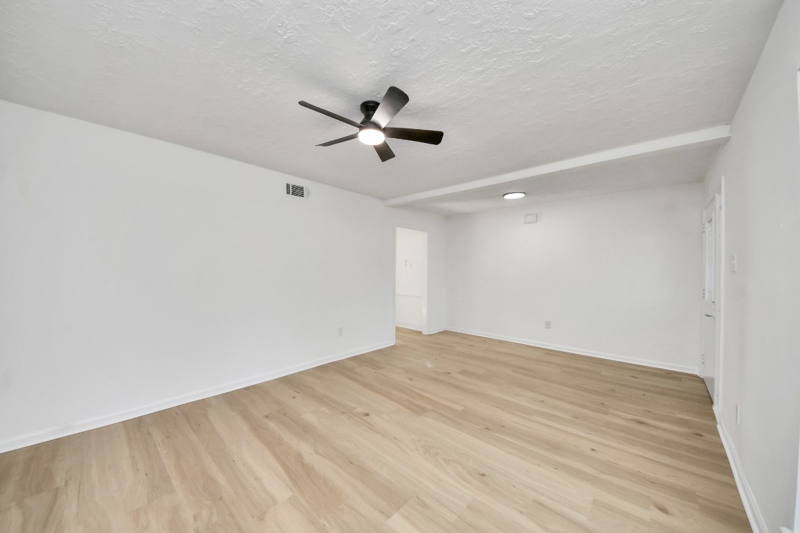 18803 Oakway Drive Spring, TX 77388 - Photo 8 of 47 a view of empty room with wooden floor