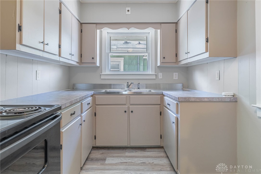2118 Hillside Avenue Springfield, OH 45503 - Photo 9 of 28 This kitchen features a practical layout, combining functionality with an understated aesthetic.