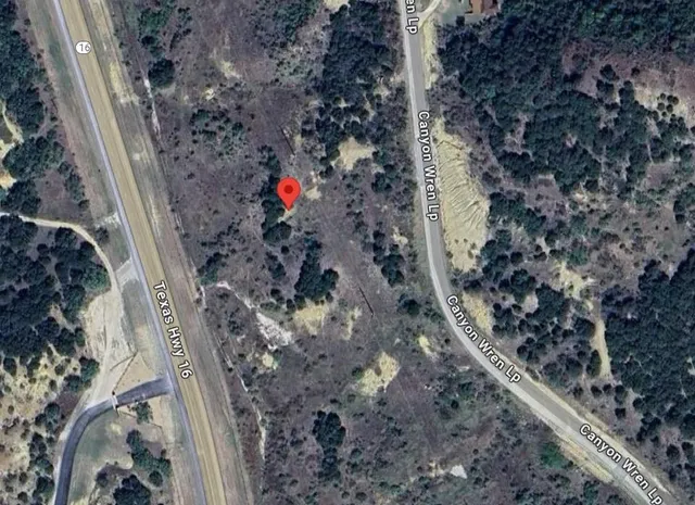 a view of a backyard of the house