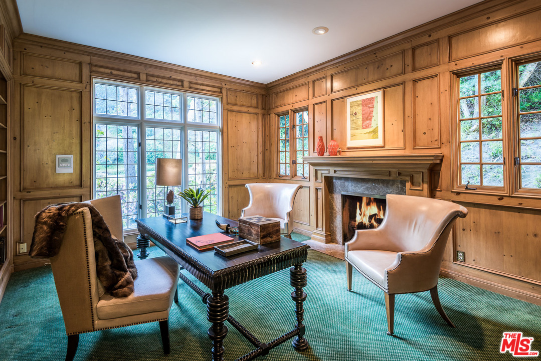 1420 Moraga Drive Los Angeles, CA 90049 - Photo 17 of 38 a living room with furniture and a large window