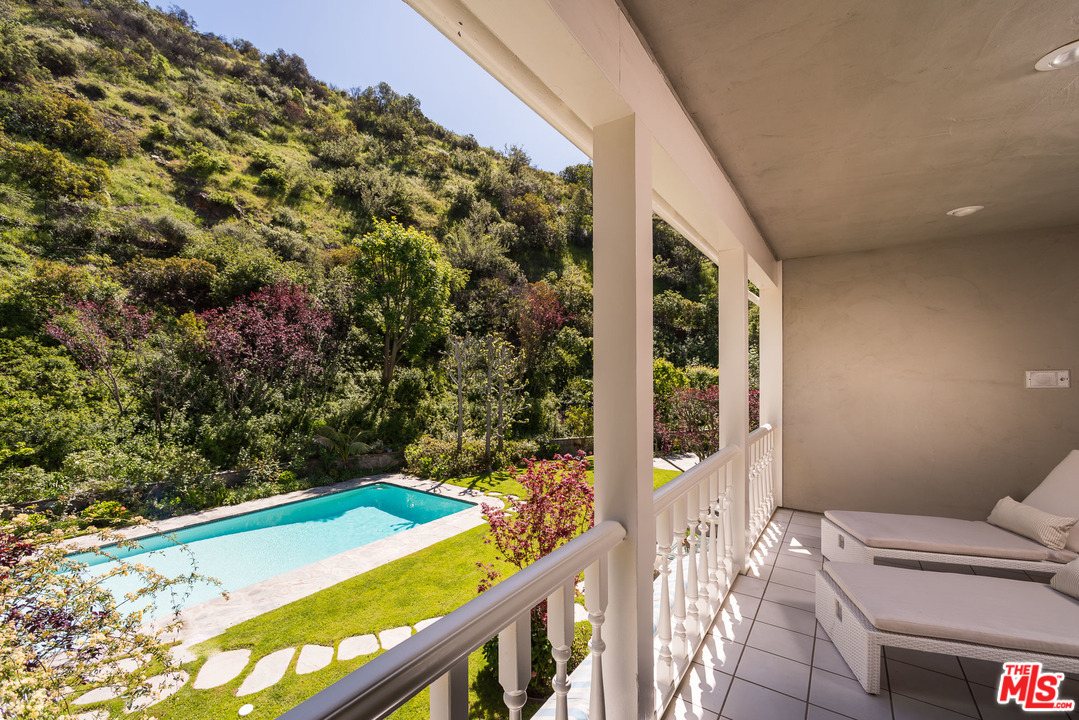 1420 Moraga Drive Los Angeles, CA 90049 - Photo 23 of 38 a view of a balcony with a plant