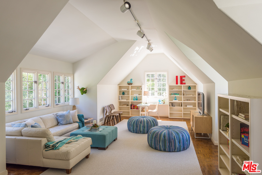 1420 Moraga Drive Los Angeles, CA 90049 - Photo 27 of 38 a living room with furniture and a large window