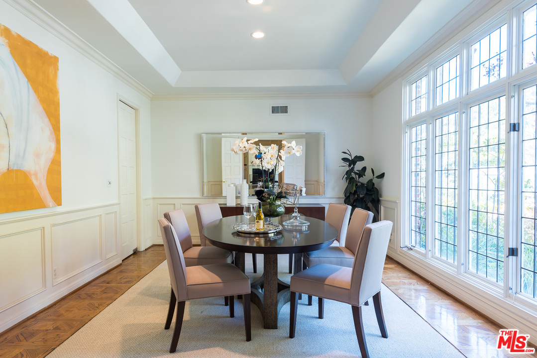1420 Moraga Drive Los Angeles, CA 90049 - Photo 7 of 38 a view of a dining room with furniture and wooden floor