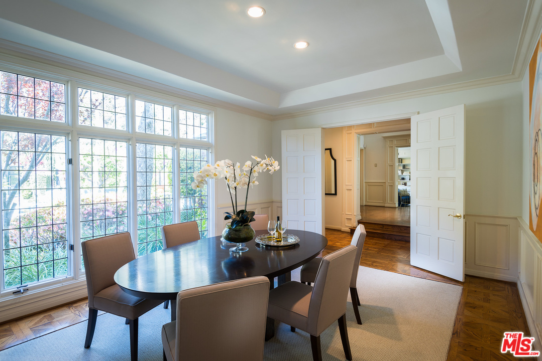 1420 Moraga Drive Los Angeles, CA 90049 - Photo 8 of 38 a view of a dining room with furniture and wooden floor