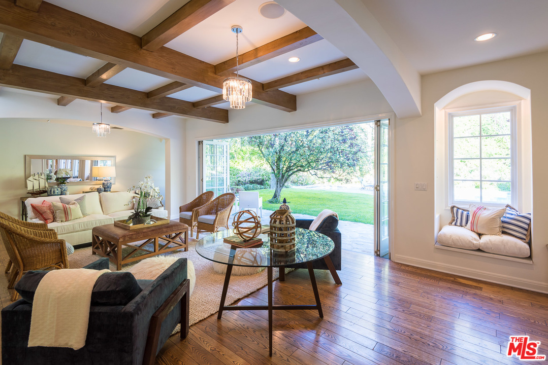 1420 Moraga Drive Los Angeles, CA 90049 - Photo 9 of 38 a living room with furniture and a large window