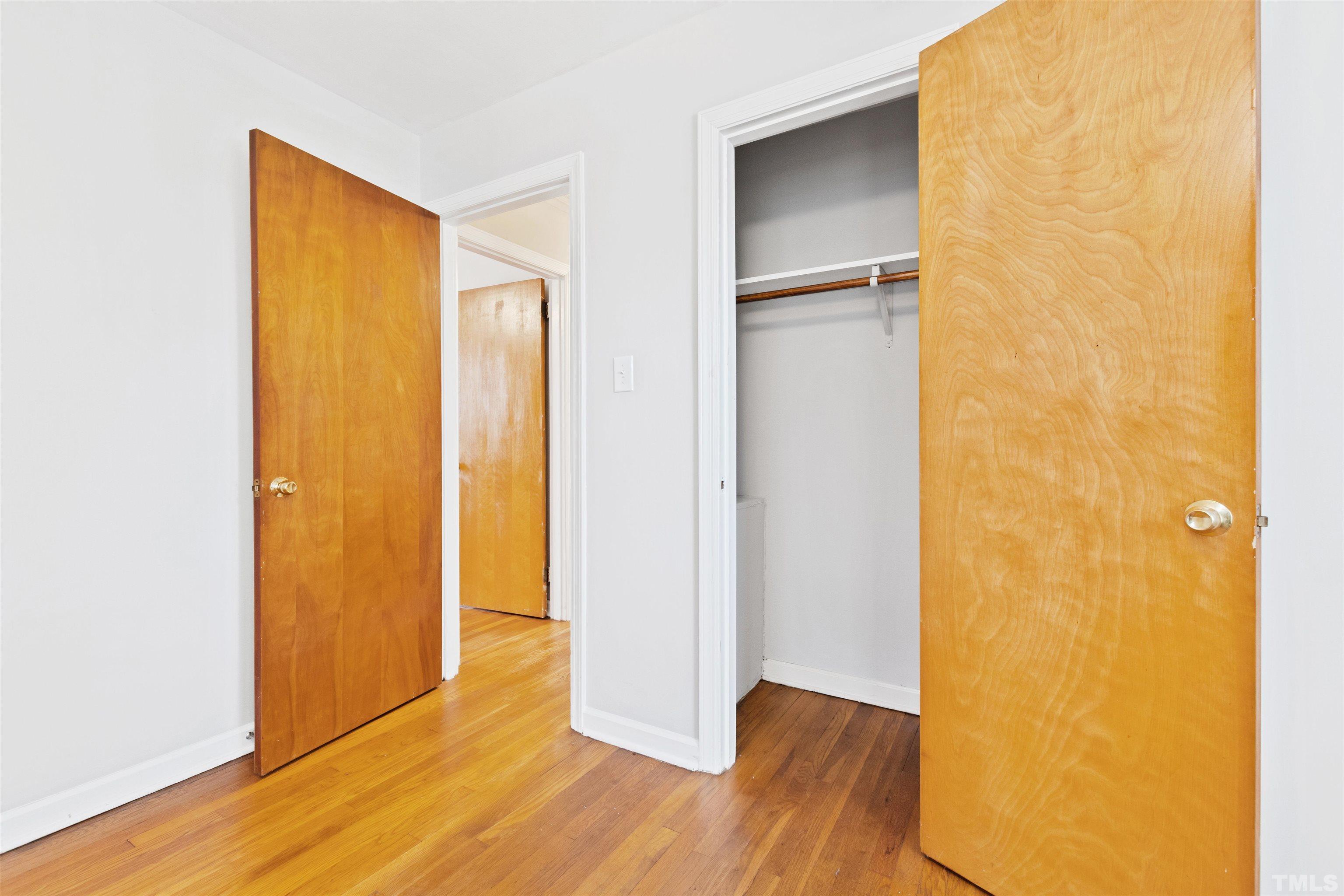 2209 Watkins Street Raleigh, NC 27604 - Photo 15 of 29 a view of an empty room with wooden floor and a window