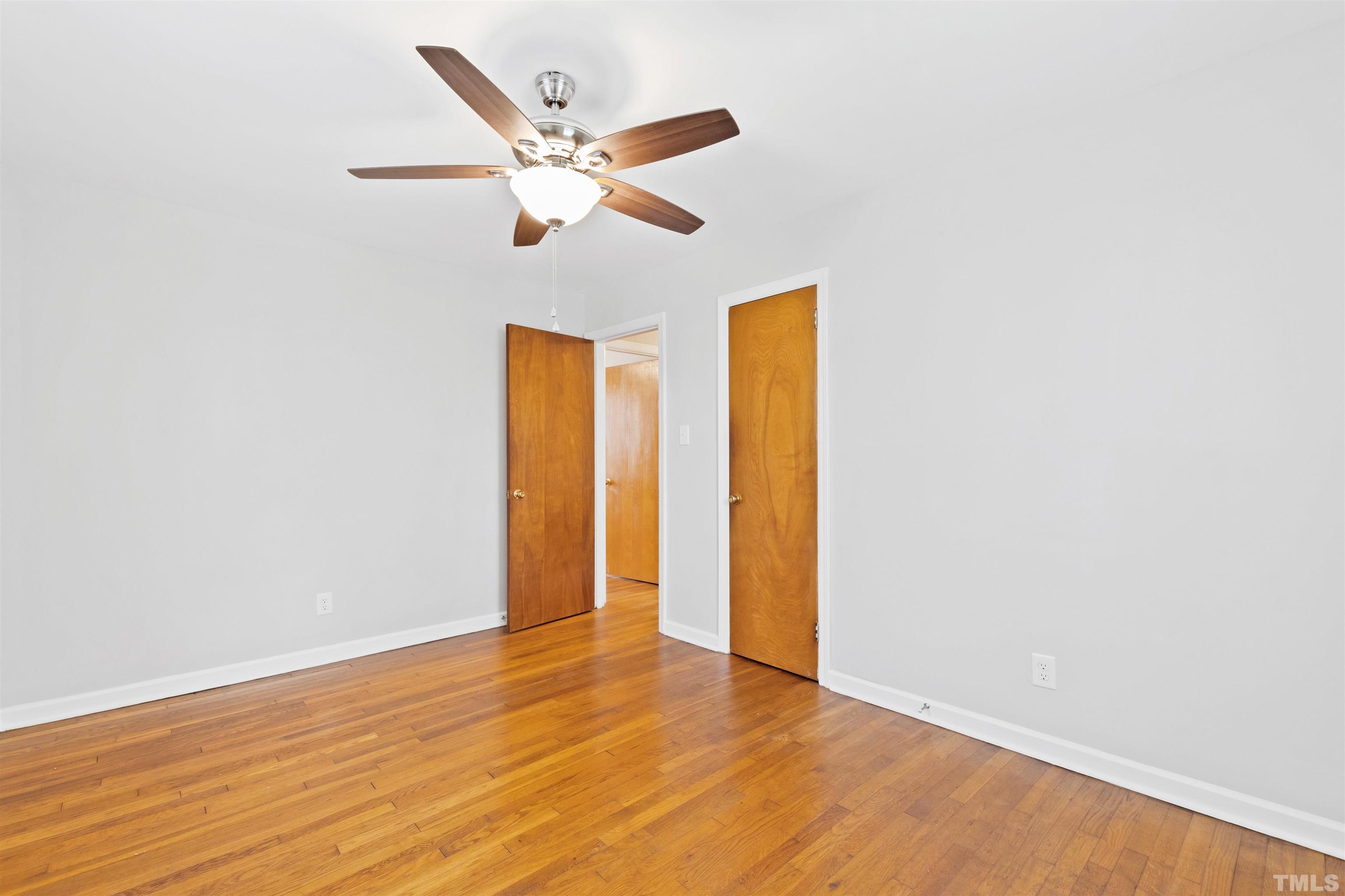 2209 Watkins Street Raleigh, NC 27604 - Photo 16 of 29 a view of an empty room with wooden floor