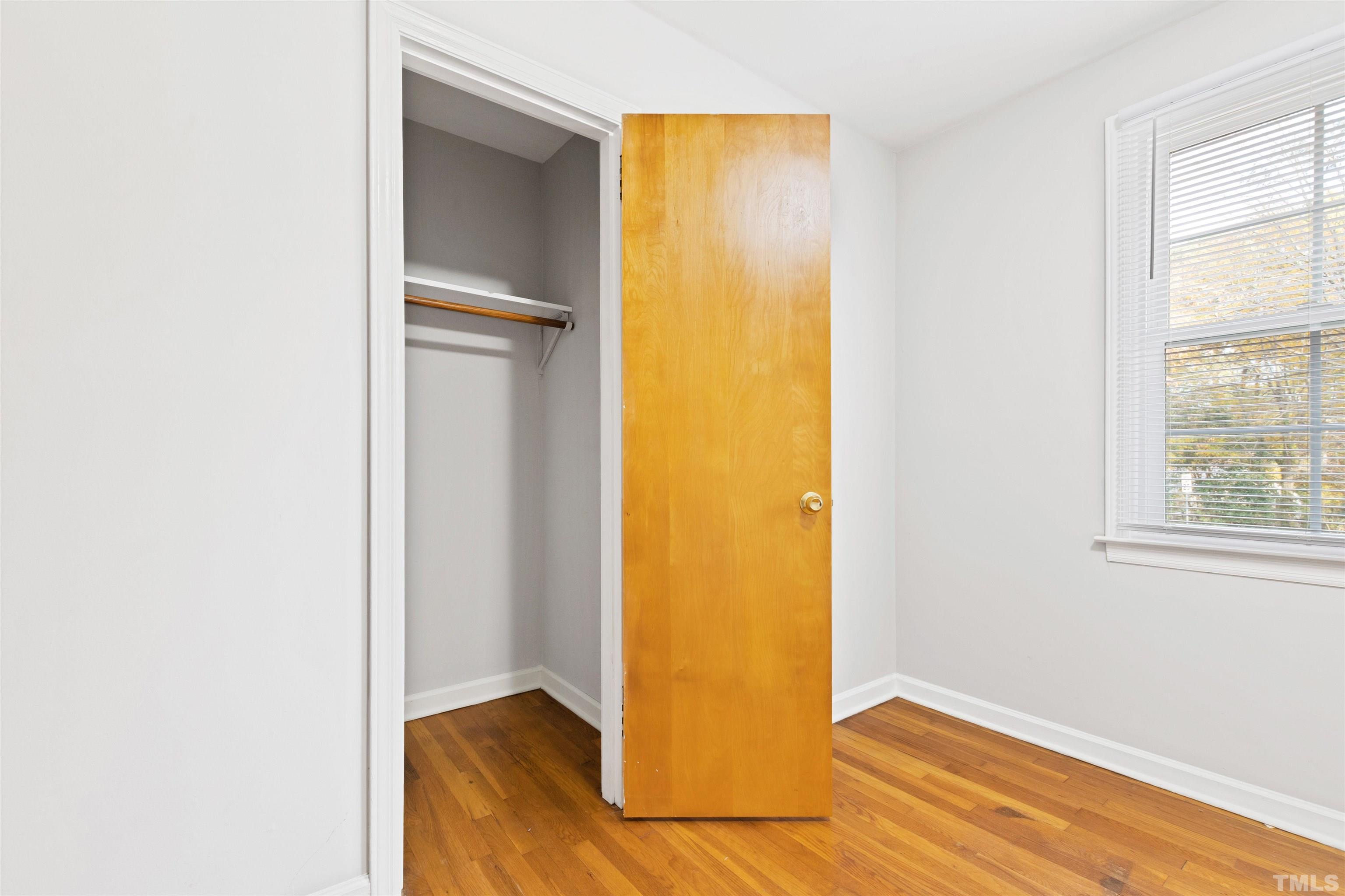 2209 Watkins Street Raleigh, NC 27604 - Photo 20 of 29 a view of an empty room with wooden floor and a window