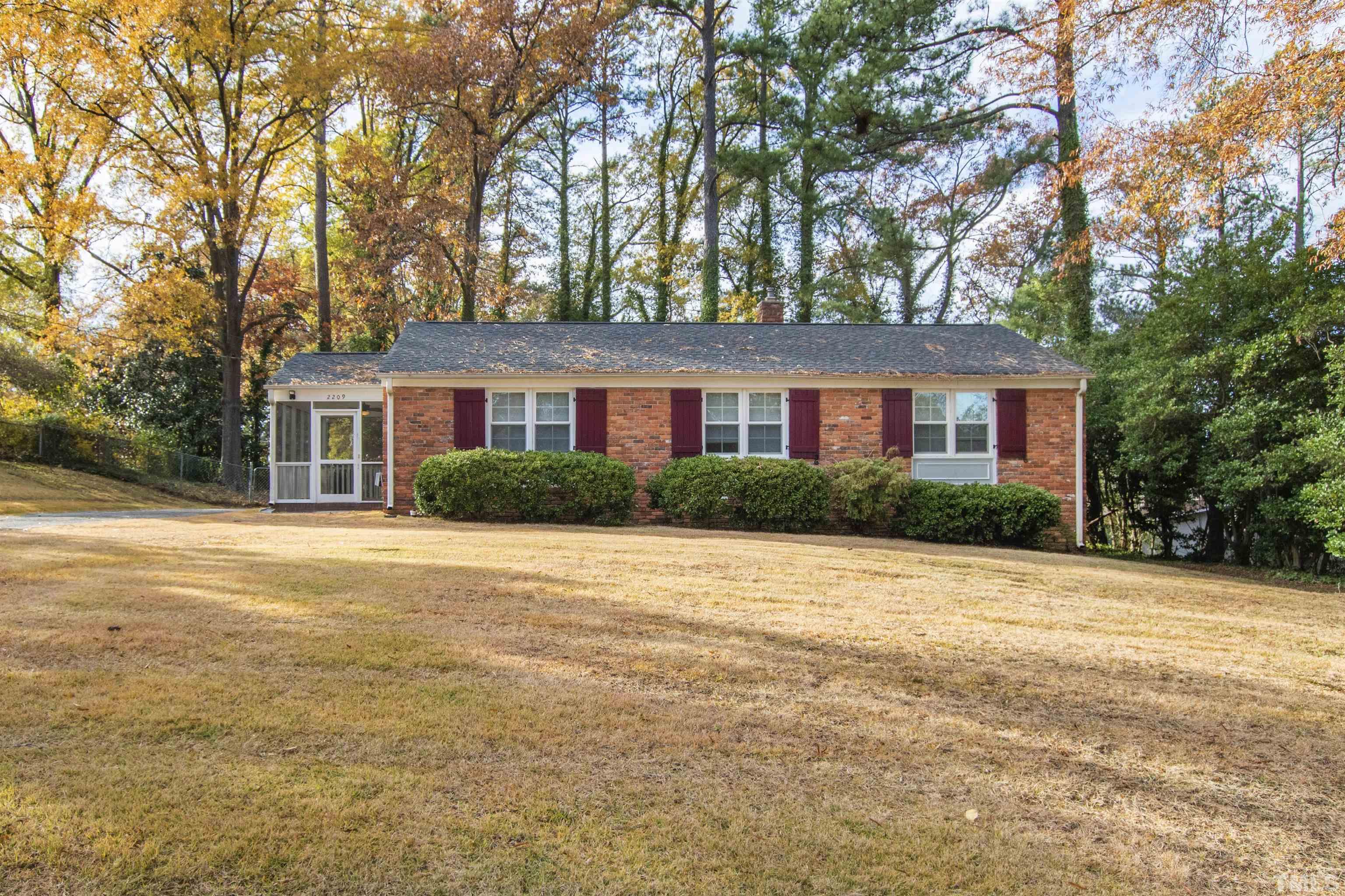 2209 Watkins Street Raleigh, NC 27604 - Photo 2 of 29 a front view of house with yard and trees around