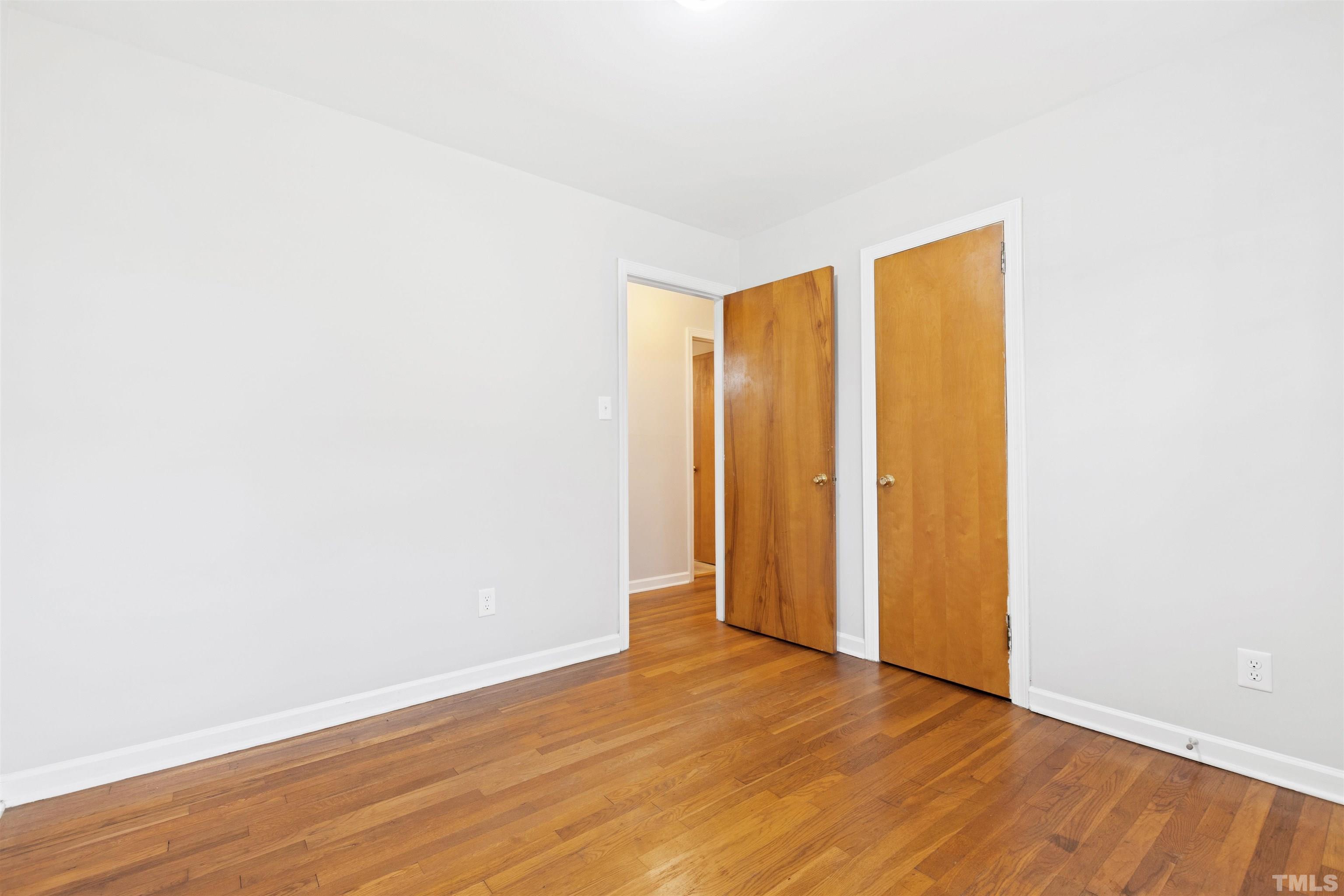 2209 Watkins Street Raleigh, NC 27604 - Photo 21 of 29 a view of an empty room with wooden floor