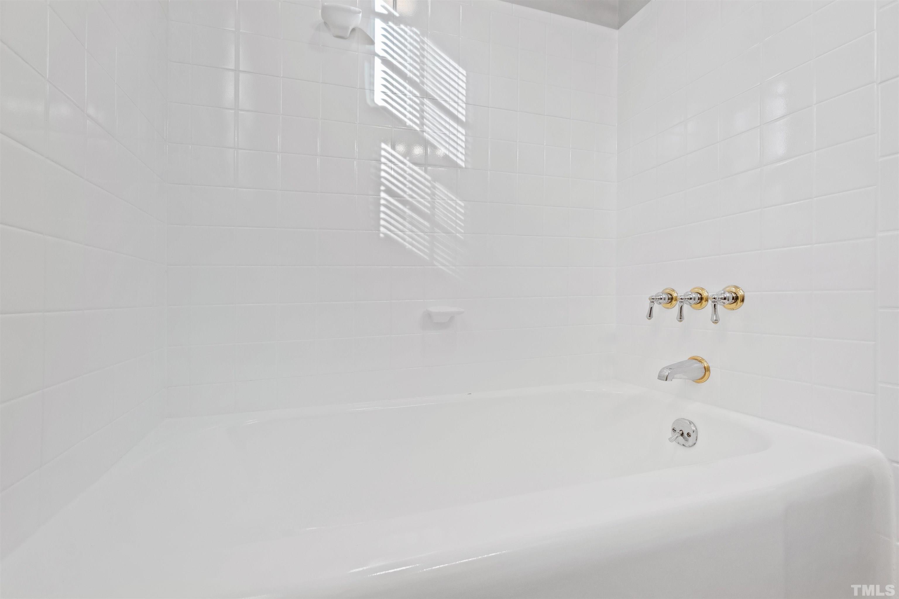 2209 Watkins Street Raleigh, NC 27604 - Photo 23 of 29 a bathroom with a bathtub