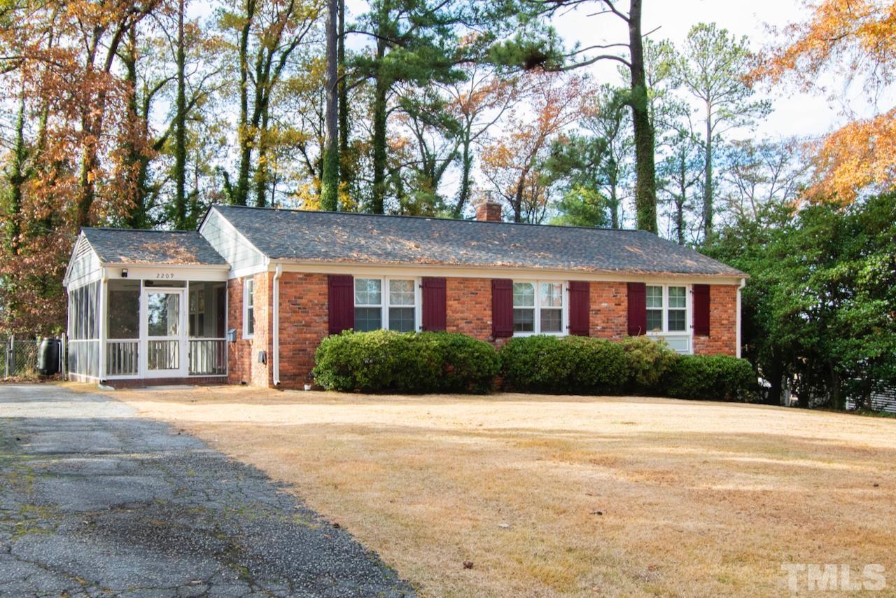 2209 Watkins Street Raleigh, NC 27604 - Photo 3 of 29 a front view of a house with a yard and garage