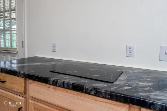 a view of kitchen counter space and stove top oven