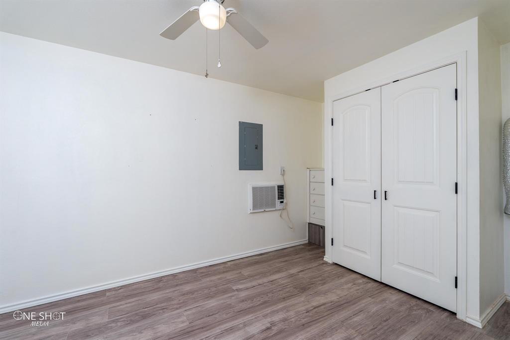 310 10th Street Hawley, TX 79525 - Photo 19 of 29 wooden floor in an empty room