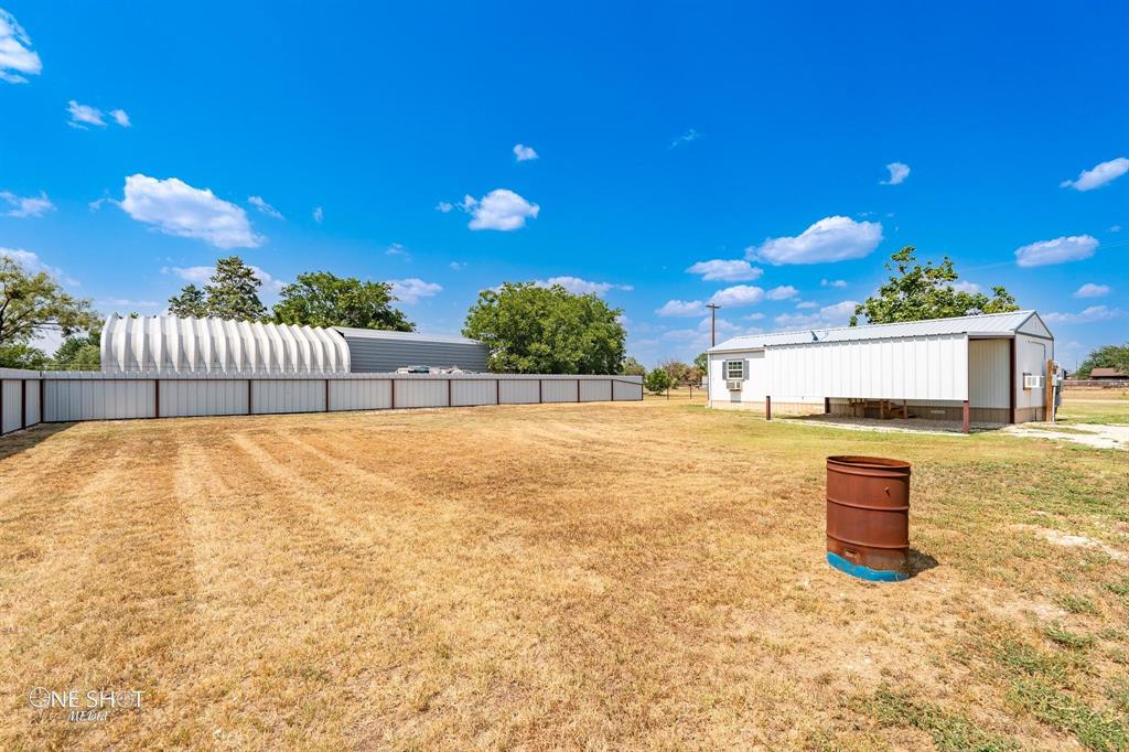 310 10th Street Hawley, TX 79525 - Photo 26 of 29 a bathroom with a sink and a mirror
