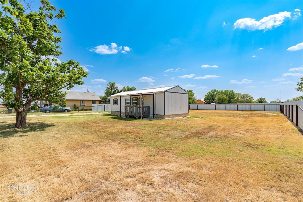 310 10th Street Hawley, TX 79525 - Photo 28 of 29 a swimming pool with an outdoor space and seating