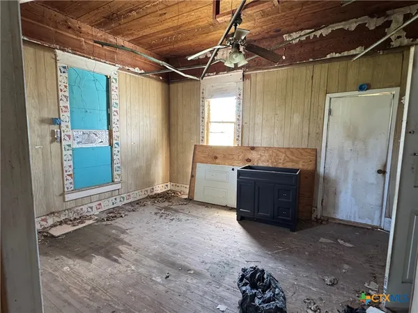 a view of a yard with large trees