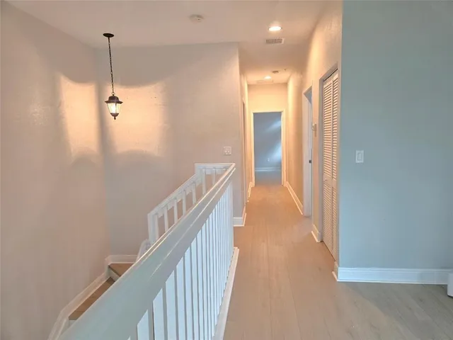 a view of a bathroom from a hallway
