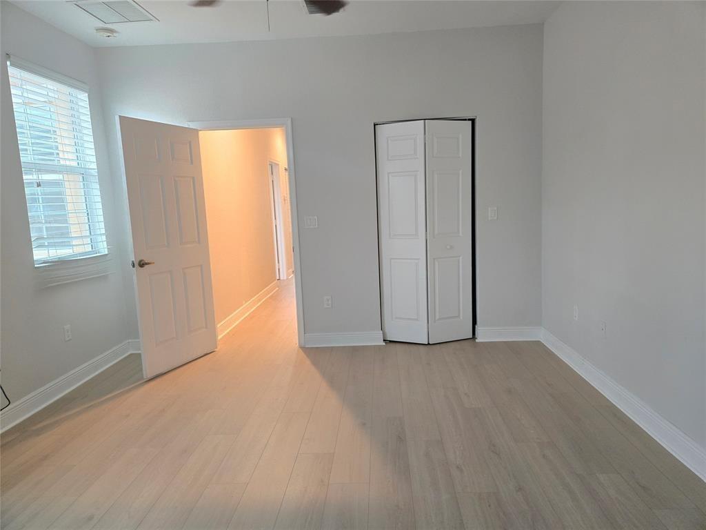 1528 Southwest 147th Avenue Pembroke Pines, FL 33027 - Photo 5 of 9 an empty room with windows and closet
