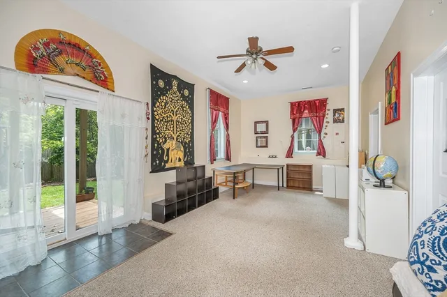 a view of a livingroom with furniture and windows