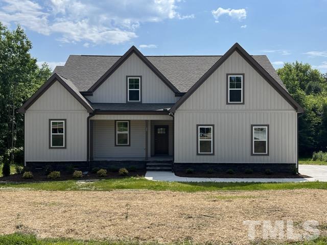 25 Pilot Ridge Road Zebulon, NC 27597 - Photo 1 of 16 a house view with a garden space