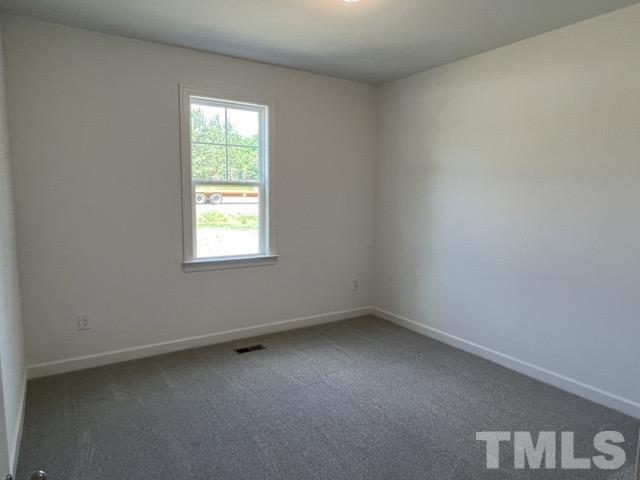 25 Pilot Ridge Road Zebulon, NC 27597 - Photo 11 of 16 an empty room with a window