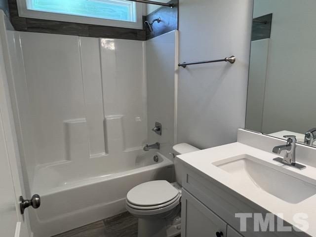 25 Pilot Ridge Road Zebulon, NC 27597 - Photo 12 of 16 a bathroom with a sink toilet and shower