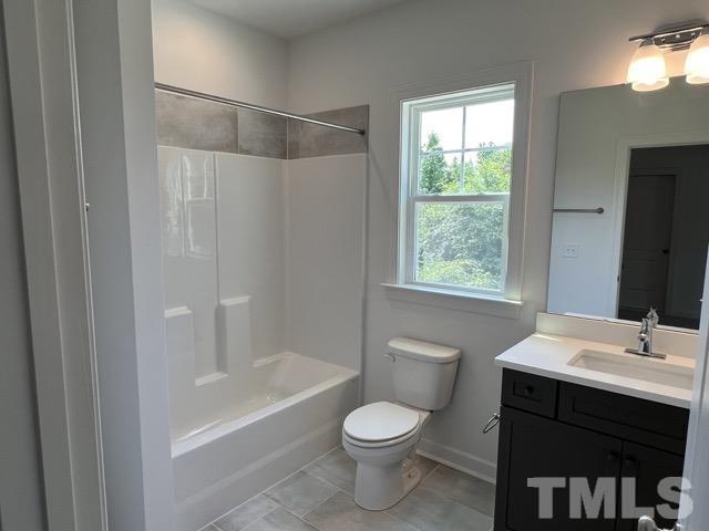 25 Pilot Ridge Road Zebulon, NC 27597 - Photo 15 of 16 a bathroom with a sink toilet and shower