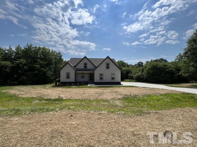 25 Pilot Ridge Road Zebulon, NC 27597 - Photo 2 of 16 a front view of a house with a yard