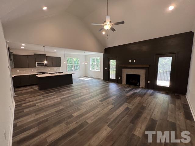 25 Pilot Ridge Road Zebulon, NC 27597 - Photo 3 of 16 a view of empty room with kitchen and fireplace