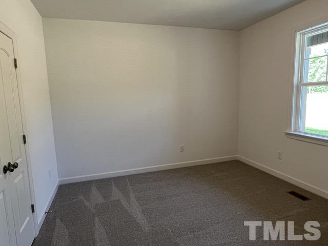 25 Pilot Ridge Road Zebulon, NC 27597 - Photo 10 of 16 a room that has a window in it
