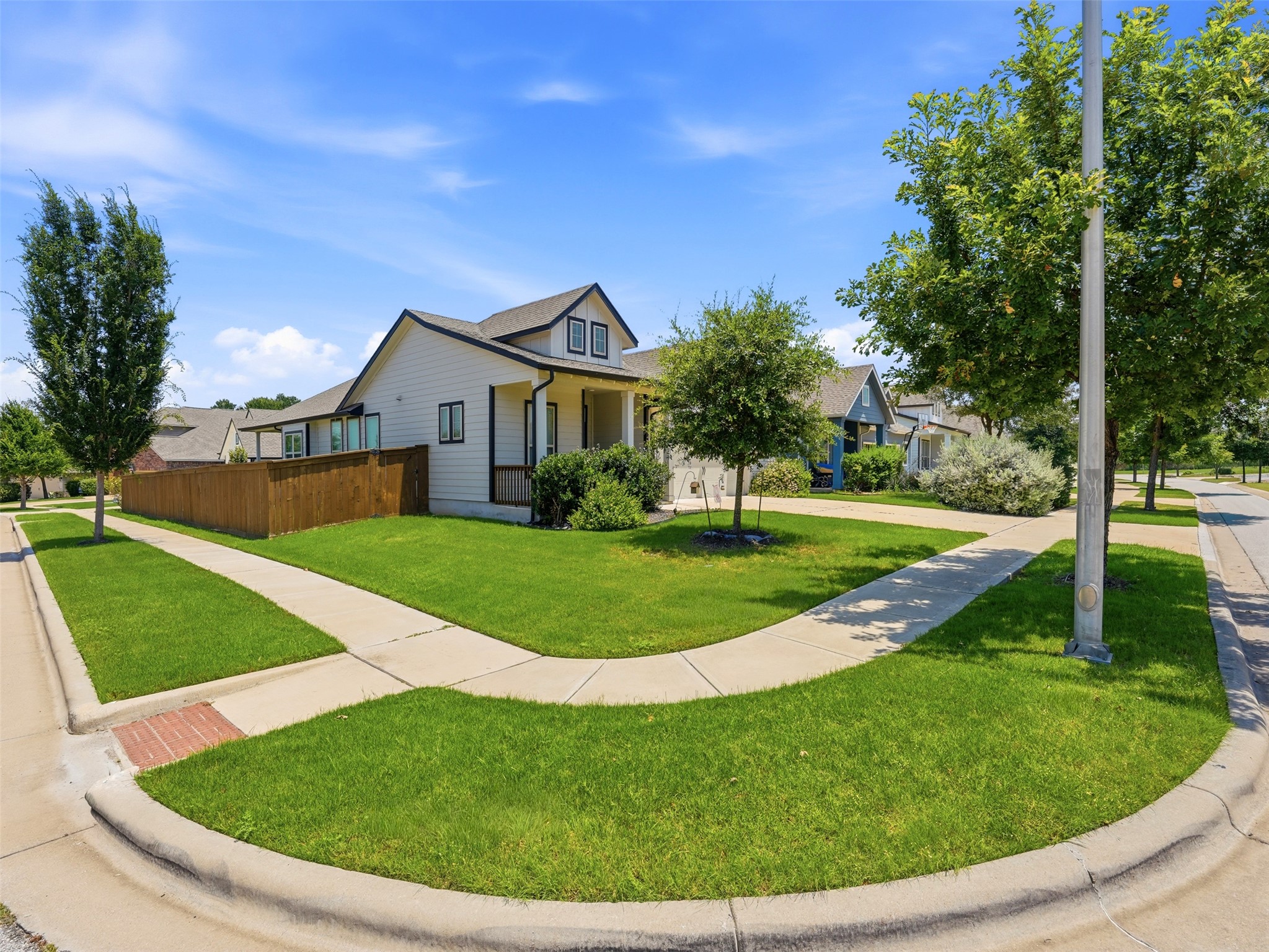2132 Ringstaff Road Leander, TX 78641 - Photo 5 of 39 A well-maintained corner lot with manicured lawns offers inviting curb appeal.