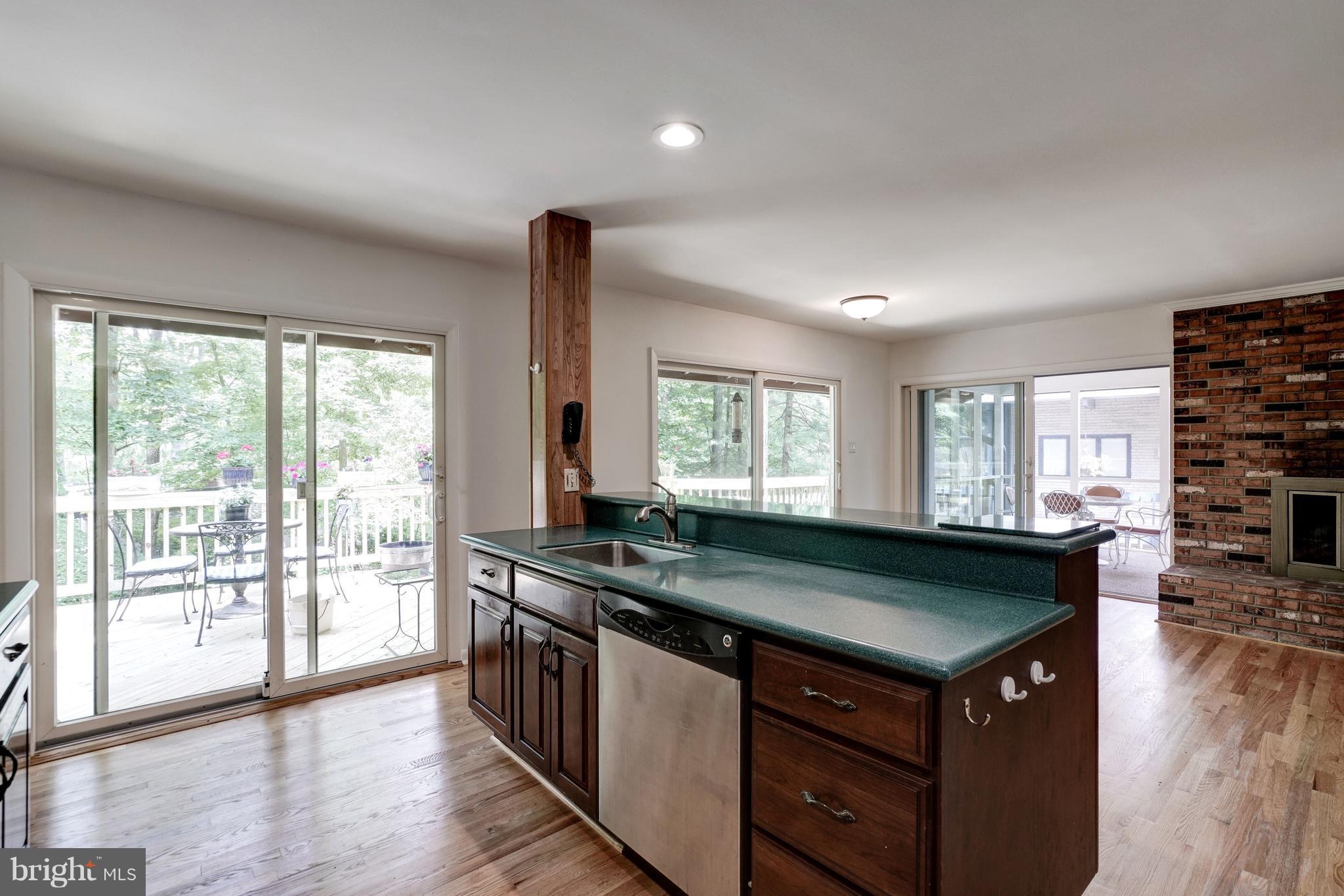 11302 Fairway Drive Reston, VA 20190 - Photo 12 of 30 a kitchen with a sink and wooden cabinets