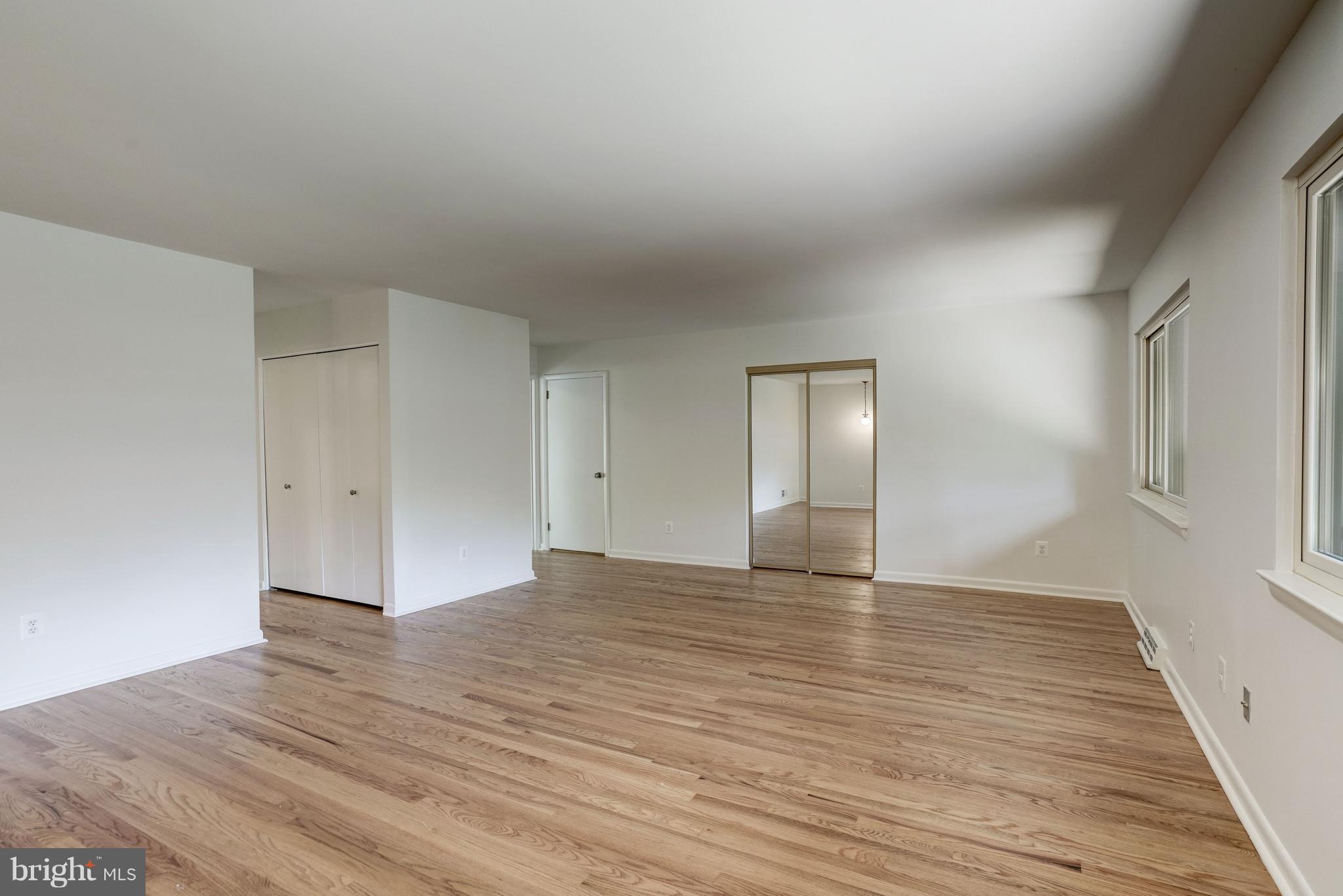 11302 Fairway Drive Reston, VA 20190 - Photo 13 of 30 a view of an empty room with wooden floor and window