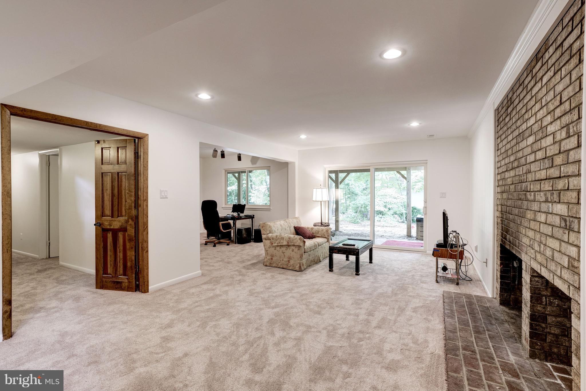 11302 Fairway Drive Reston, VA 20190 - Photo 18 of 30 a living room with furniture large window and a fireplace
