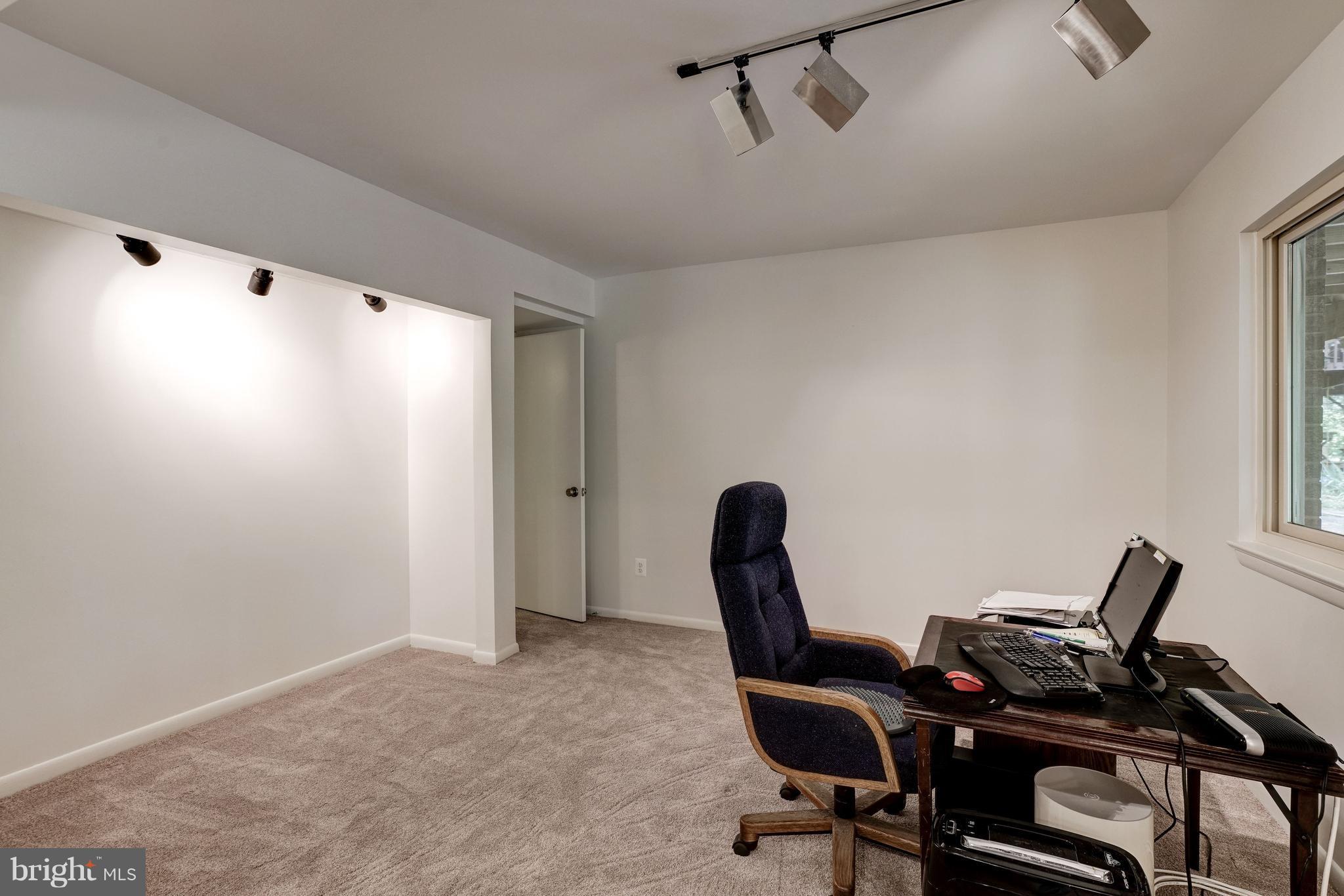 11302 Fairway Drive Reston, VA 20190 - Photo 19 of 30 a view of a workspace with furniture and a window