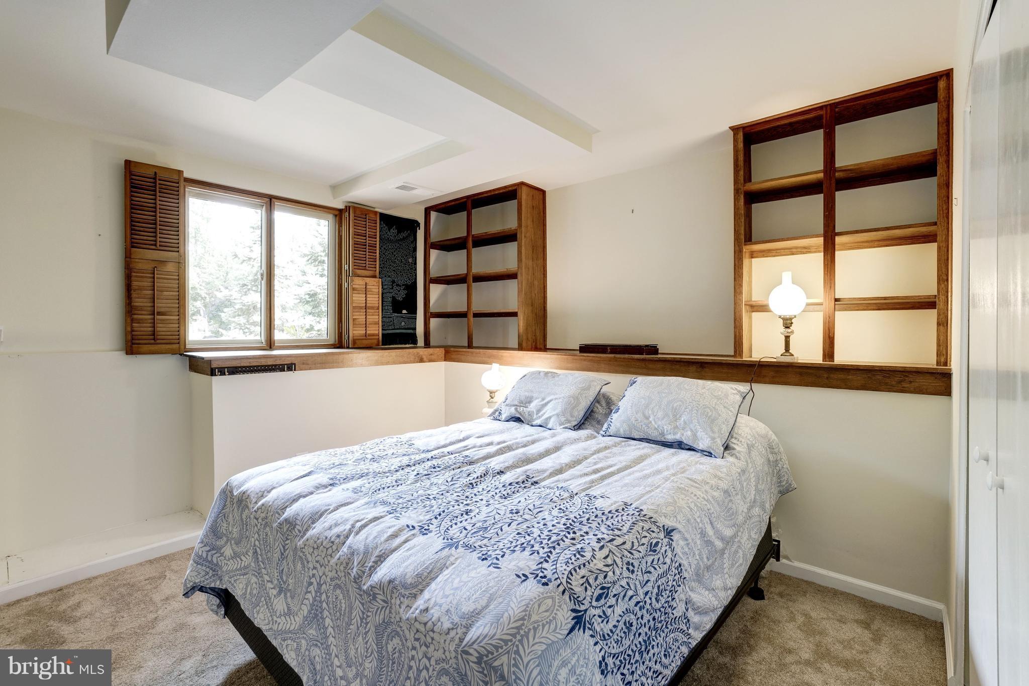 11302 Fairway Drive Reston, VA 20190 - Photo 20 of 30 a bedroom with a large bed and a window