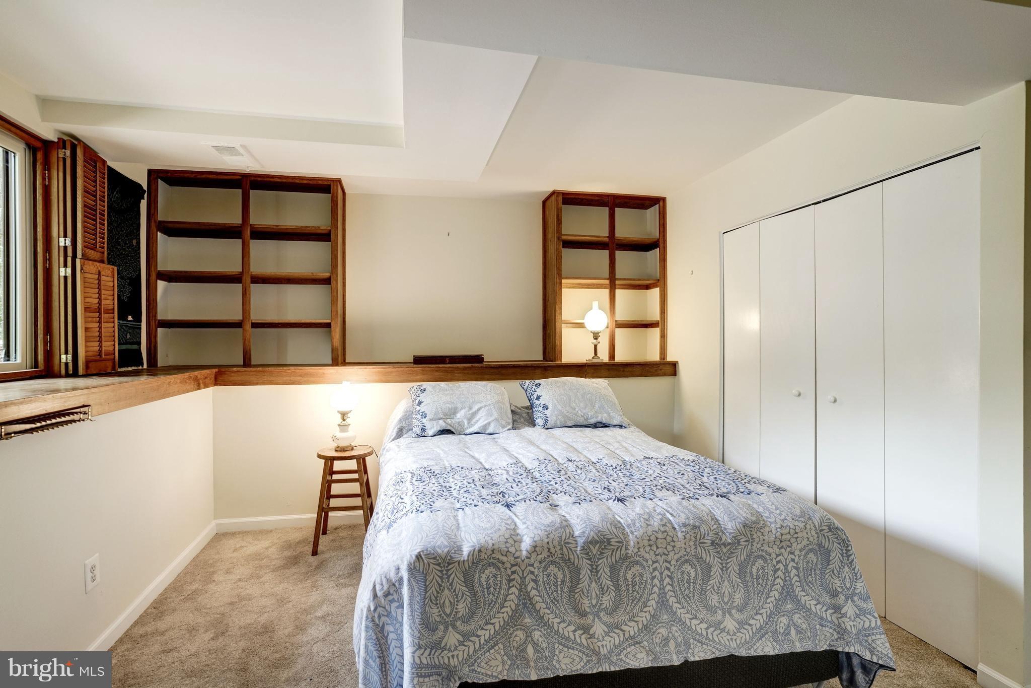 11302 Fairway Drive Reston, VA 20190 - Photo 21 of 30 a bedroom with a bed and a window