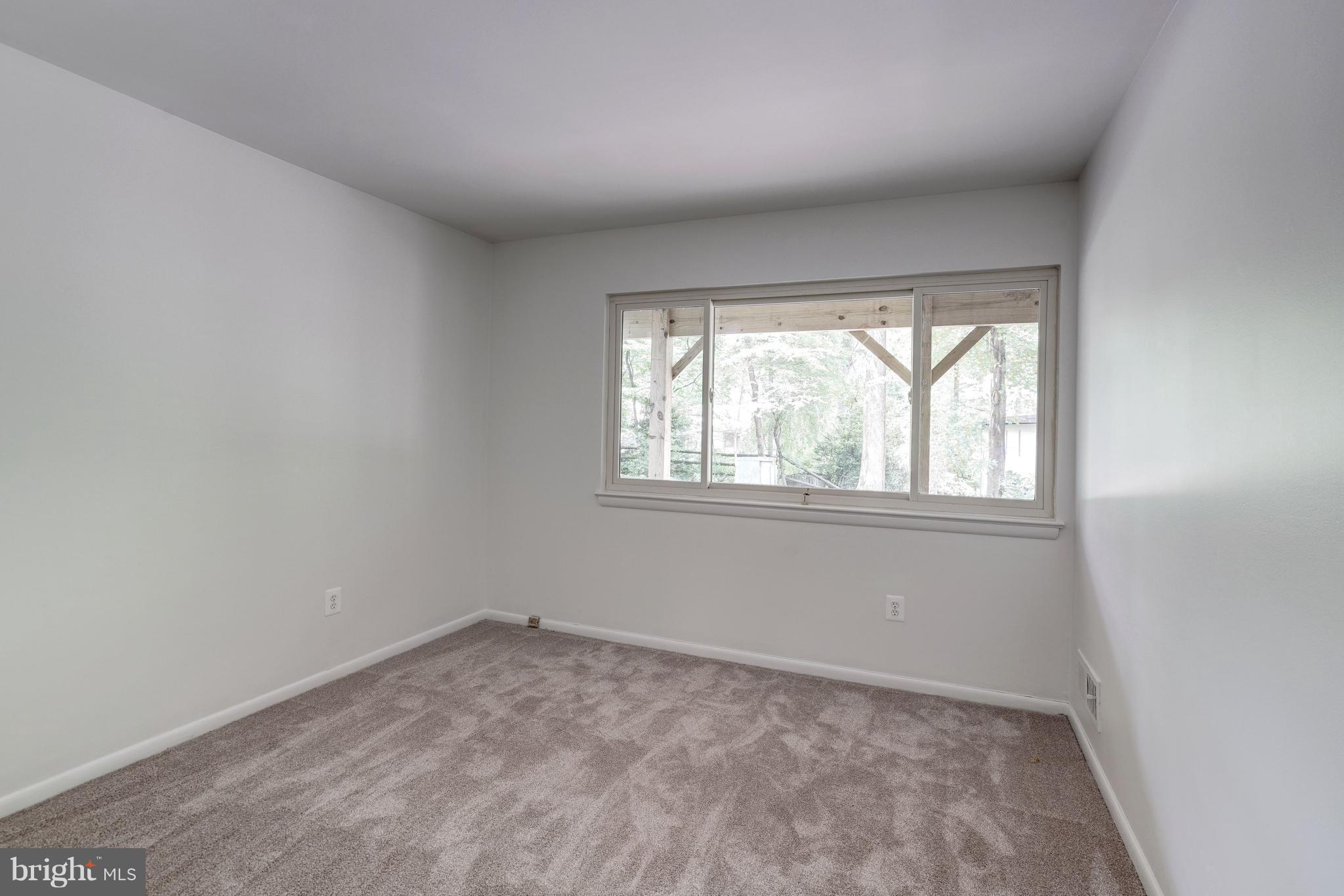 11302 Fairway Drive Reston, VA 20190 - Photo 23 of 30 an empty room with a window